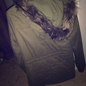 Green jacket with fur hood